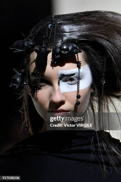 Model walks the runway during the Yohji Yamamoto Ready to Wear fashion show as part of the Paris Fashion Week Womenswear Fall/Winter 2018/2019 on...