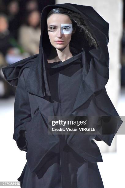 Model walks the runway during the Yohji Yamamoto Ready to Wear fashion show as part of the Paris Fashion Week Womenswear Fall/Winter 2018/2019 on...