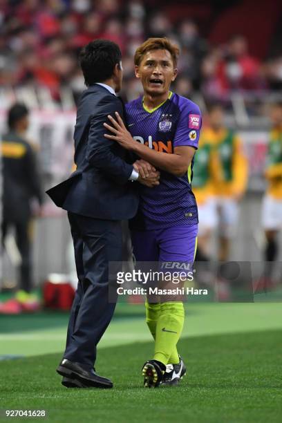 Toshihiro Aoyama and coach,Hiroshi Jofuku of Sanfrecce Hiroshima shake hands during the J.League J1 match between Urawa Red Diamonds and Sanfrecce...