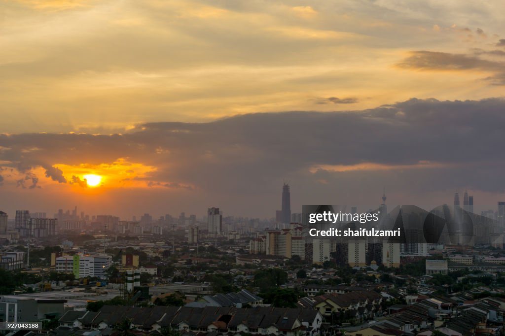 View of sunset at downtown Kuala Lumpur. Its modern skyline is dominated by the 451m tall Petronas Twin Towers, pair of of glass-and-steel-clad skyscraper.