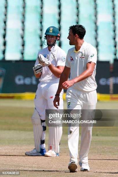 Australian bowler Mitchell Starc sledges South African batsman Theunis de Bruyn during the fourth day of the first Test cricket match between South...