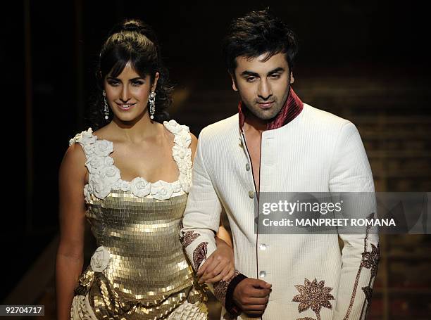 Indian actress Katrina Kaif and Indian actor Ranbir Kapoor present a creation by Indian designer Rohit Bal during the Grand Finale of the Wills India...