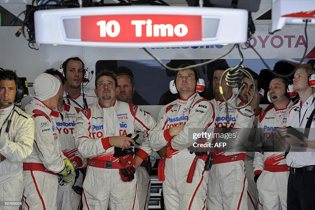 Toyota F1 Team mechanics watch as Timo G