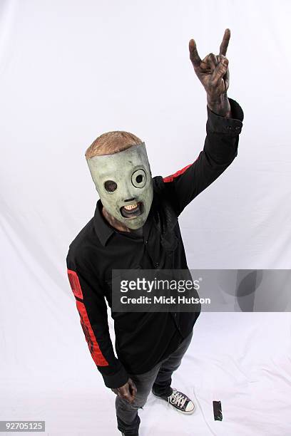 Corey Taylor of Slipknot poses for a studio portrait session, holding up his hand in a devil horn gesture, backstage at the Download Festival,...
