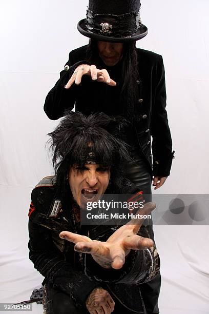 Nikki Sixx and Mick Mars of Motley Crue pose for a studio portrait session backstage at the Download Festival, Donington Park, Leicestershire on June...