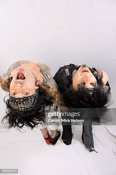 Tommy Lee and Nikki Sixx of Motley Crue pose for a studio portrait session backstage at the Download Festival, Donington Park, Leicestershire on June...