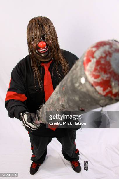Shawn Crahan of Slipknot poses for a studio portrait session, holding a baseball bat, backstage at the Download Festival, Donington Park,...