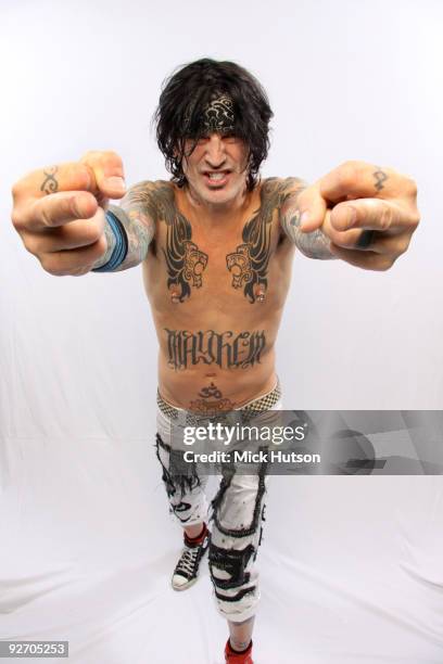 Tommy Lee of Motley Crue poses for a studio portrait session, raising hs middle fingers, backstage at the Download Festival, Donington Park,...