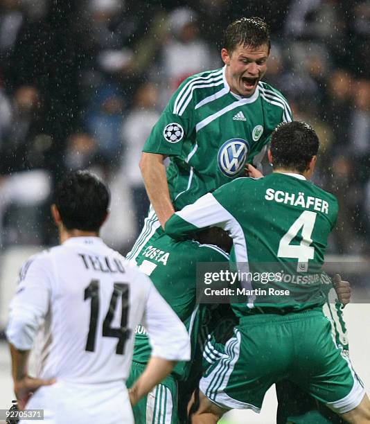 Alexander Madlung of Wolfsburg celebrates his team's second goal with team mates during the UEFA Champions League Group B match between Besiktas and...