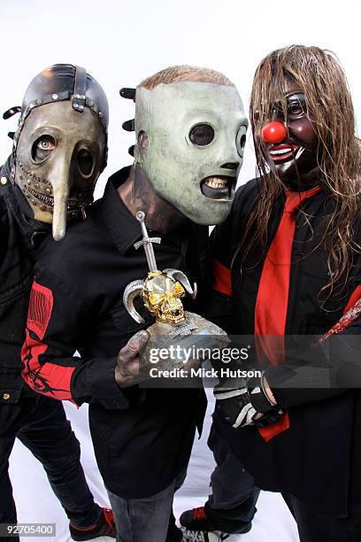 Chris Fehn , Corey Taylor and Shawn Crahan of Slipknot pose for a studio portrait session, holding a Metal Hammer Golden Gods award, backstage at the...