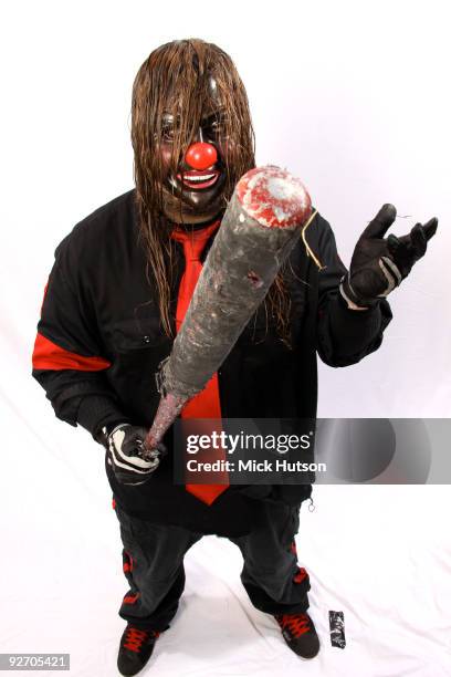 Shawn Crahan of Slipknot poses for a studio portrait session, holding a baseball bat, backstage at the Download Festival, Donington Park,...