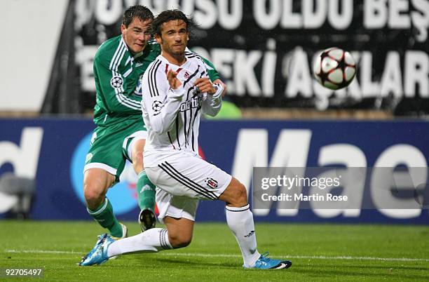 Ibrahim Kas of Besiktas and Marcel Schaefer of Wolfsburg compete for the ball during the UEFA Champions League Group B match between Besiktas and VfL...