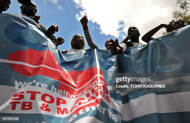 Kenyans hold a procession on November 4, 2009 on the sidelines of the fifth Multilateral Initiative on Malaria conference in the Kenyan capital...