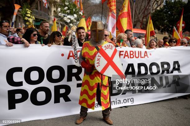 Man dressed as Sant Jordi attends a pro-unity rally organized by the Tabarnia movement, a fictional region that wants independence from Catalonia, on...