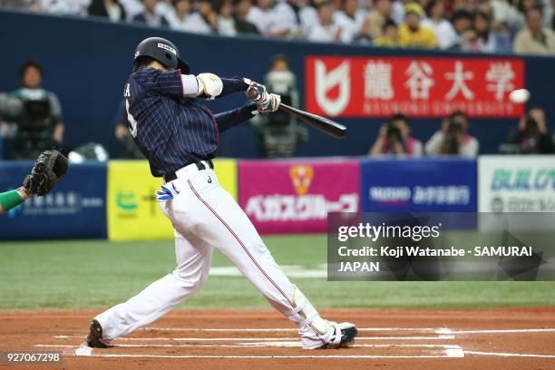 Shogo Akiyama of Japan one-run double in the top half of the sixth inning during the game two of the baseball international match between Japan and...