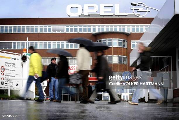 Workers leave the Opel plant in the western German city of Bochum on November 4, 2009. US auto giant General Motors' U-turn on selling its embattled...