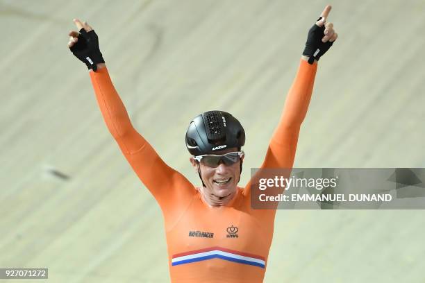 Netherlands Kirsten Wild celebrates winning the women's points race final during the UCI Track Cycling World Championships in Apeldoorn on March 4,...