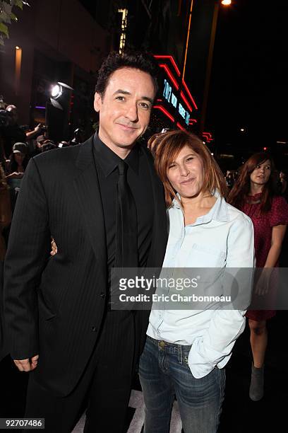 John Cusack and Sony's Amy Pascal at Columbia Pictures Premiere of "2012" at Regal Cinemas LA Live on November 03, 2009 in Los Angeles, California.