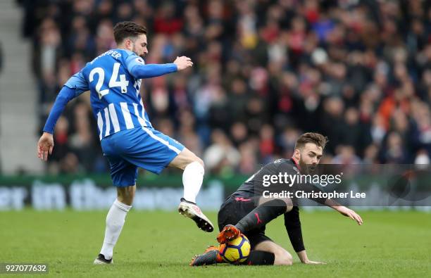 Calum Chambers of Arsenal tackles Davy Propper of Brighton and Hove Albion during the Premier League match between Brighton and Hove Albion and...