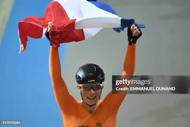 Netherlands Kirsten Wild celebrates winning the women's points race final during the UCI Track Cycling World Championships in Apeldoorn on March 4,...