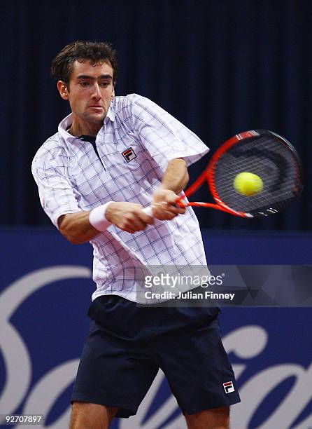 Marin Cilic of Croatia plays a backhand in his match against Philipp Petzschner of Germany during Day Three of the Davidoff Swiss Indoors Tennis at...