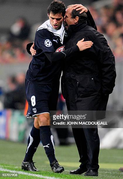 Bordeaux' French midfielder Yoann Gourcuff celebrates with Bordeaux' assistant coach Jean-Louis Gasset after he scored during the Bayern Munich vs...