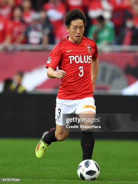 Tomoya Ugajin of Urawa Red Diamonds in action during the J.League J1 match between Urawa Red Diamonds and Sanfrecce Hiroshima at Saitama Stadium on...