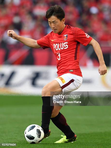 Tomoya Ugajin of Urawa Red Diamonds in action during the J.League J1 match between Urawa Red Diamonds and Sanfrecce Hiroshima at Saitama Stadium on...