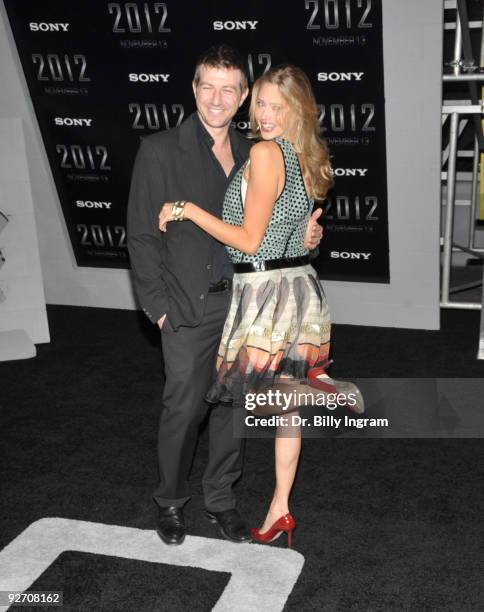 Gavin Keilly and Estella Warren arrive at the "2012" Premiere at Regal 14 at LA Live Downtown on November 3, 2009 in Los Angeles, California.