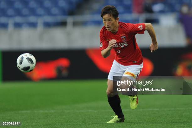 Tomoya Ugajin of Urawa Red Diamonds in action during the J.League J1 match between Urawa Red Diamonds and Sanfrecce Hiroshima at Saitama Stadium on...