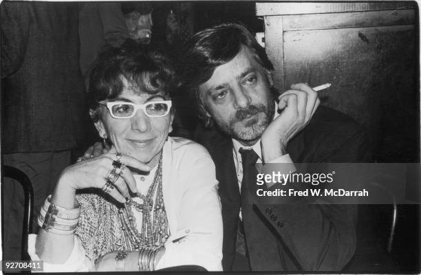 Italian film director Lina Wertmuller and her frequent lead actor Giancarlo Giannini pose together at a table, January 29, 1978.
