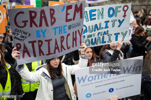 Thousands of protesters march with placards from the House of Parliament to Trafalgar Square during the March4Women event on March 4, 2018 in London,...