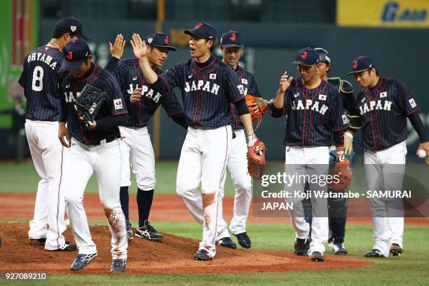 Shogo Akiyama of Japan with teammate celerates after winning during the game two of the baseball international match between Japan and Australia at...