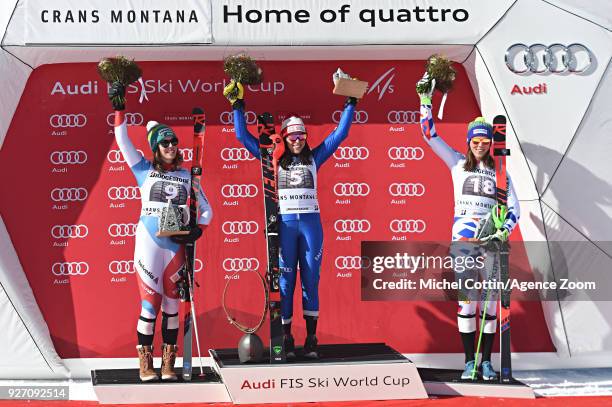 Michelle Gisin of Switzerland takes 2nd place, Federica Brignone of Italy takes 1st place, Petra Vlhova of Slovakia takes 3rd place during the Audi...