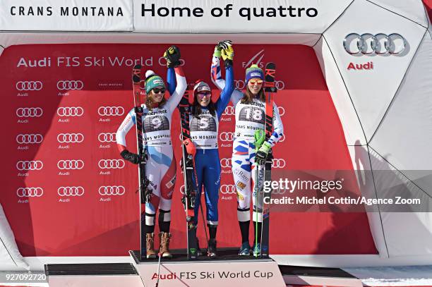 Michelle Gisin of Switzerland takes 2nd place, Federica Brignone of Italy takes 1st place, Petra Vlhova of Slovakia takes 3rd place during the Audi...