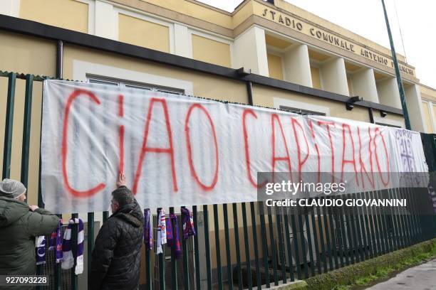 Giant banner reading "Ciao Captain" is hanged on the fence of Fiorentina's stadium, on March 4, 2018 in Florence. Italy international defender Davide...