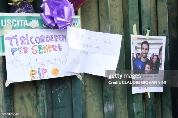 Football fans hang scarves and hommages to late Fiorentina's captain Davide Astori on the fence of Fiorentina's stadium, on March 4, 2018 in...