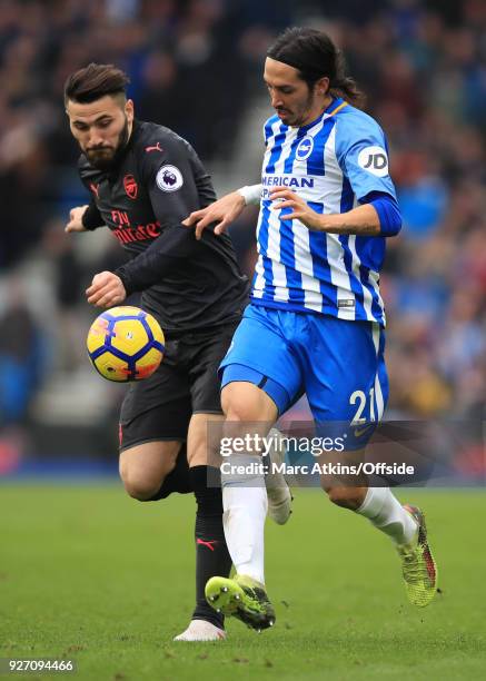 Sead Kolasinac of Arsenal in action with Ezequiel Schelotto of Brighton and Hove Albion during the Premier League match between Brighton and Hove...