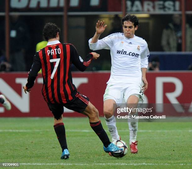 Alexandre Pato of AC Milan tackles Ricardo Kaka of Real Madrid during the UEFA Champions League group C match between AC Milan and Real Madrid at the...
