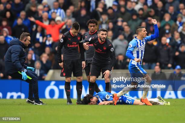 Anthony Knockaert of Brighton and Hove Albion appeals after Sead Kolasinac of Arsenal collides with Ezequiel Schelotto during the Premier League...