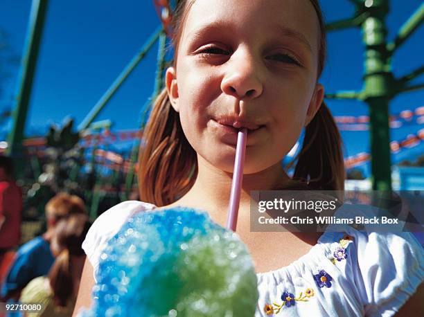 girl at a fairground. - snow cones shaved ice stock pictures, royalty-free photos & images