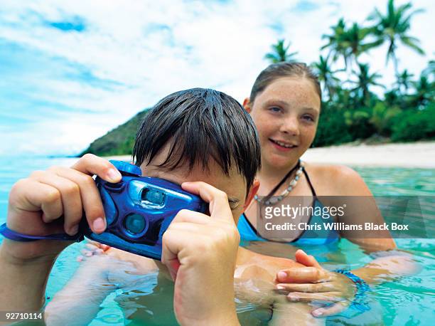 fun, sea and sun in fiji. - fiji family stock-fotos und bilder