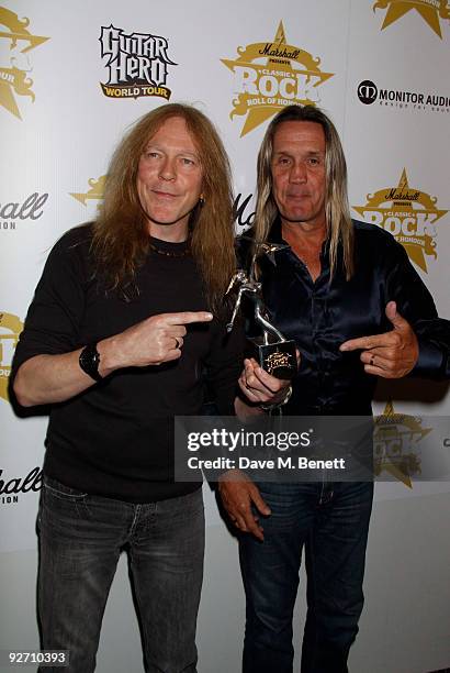 Janick Gers and Nicko McBrain from the rock group Iron Maiden, with their Band of the Year award, attend the Classic Rock Hall of Fame Awards at the...