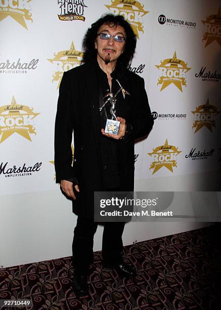 Tony Iommi from the rock group Black Sabbath, with the Best ReIssue award, attends the Classic Rock Hall of Fame Awards at the Park Lane Hotel on...