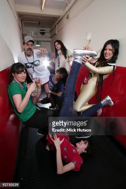 Adriano Cintra, Luiza Sa , Iracema Trevisana , Lovefoxxx, Ana Rezende and Carolina Parra of CSS pose for a group portrait backstage at Brixton...