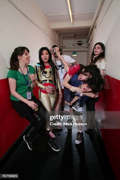 Carolina Parra, Lovefoxxx, Adriano Cintra, Ana Rezende, Luiza Sa and Iracema Trevisan of CSS pose for a group portrait backstage at Brixton Academy...