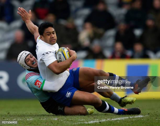Ben Tapuai of Bath Rugby tackled by Demetri Catrakilis of Harlequins during the Aviva Premiership match between Harlequins and Bath Rugby at...