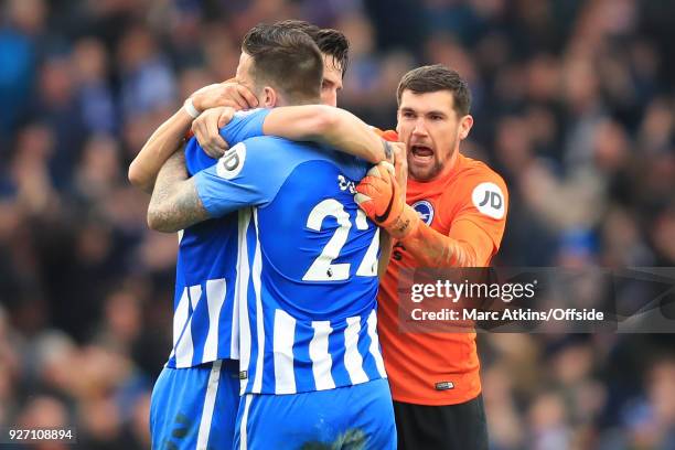 Lewis Dunk, Shane Duffy and Matthew Ryan of Brighton and Hove Albion celebrate during the Premier League match between Brighton and Hove Albion and...