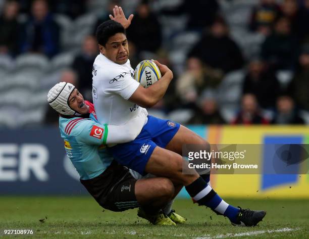 Ben Tapuai of Bath Rugby tackled by Demetri Catrakilis of Harlequins during the Aviva Premiership match between Harlequins and Bath Rugby at...