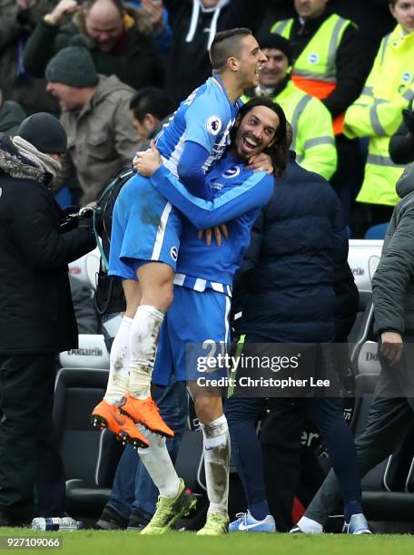 Anthony Knockaert and Matias Ezequiel Schelotto of Brighton and Hove Albion celebrate following the Premier League match between Brighton and Hove...